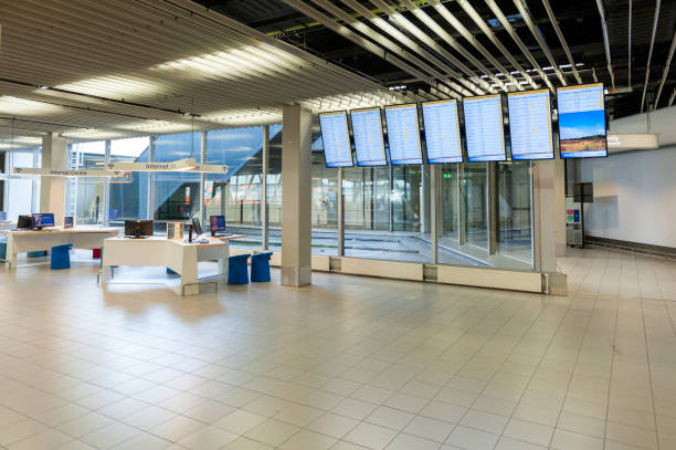 International Amsterdam Airport Schiphol Interior with Passengers. Empty Departure Area with Screens. Netherlands Amsterdam, Netherlands - October 18, 2017: International Amsterdam Airport Schiphol Interior with Passengers. Empty Departure Area with Screens. Netherlands retail digital signage stock pictures, royalty-free photos & images