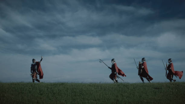 Four Roman soldiers come out to attack in the evening in open territory.