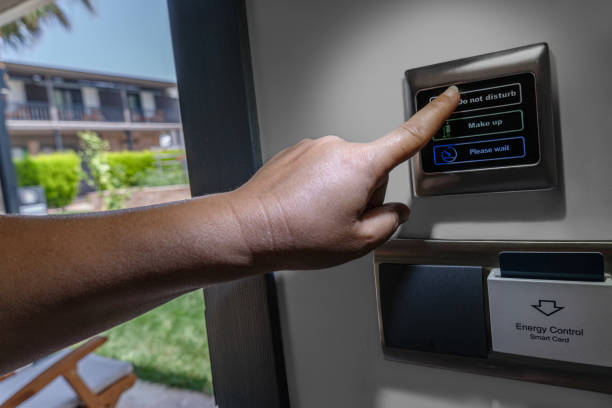 istock A hand presses the room service button. 1568151658