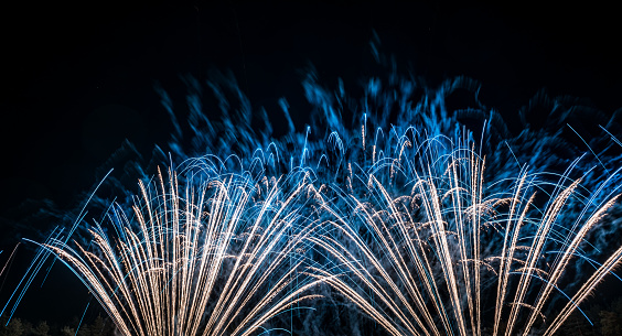 Colorful Fireworks Explosion in dark night sky. Festival Moment.