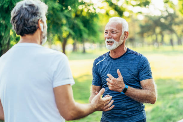 istock Senior friends resting after jogging 1568188556