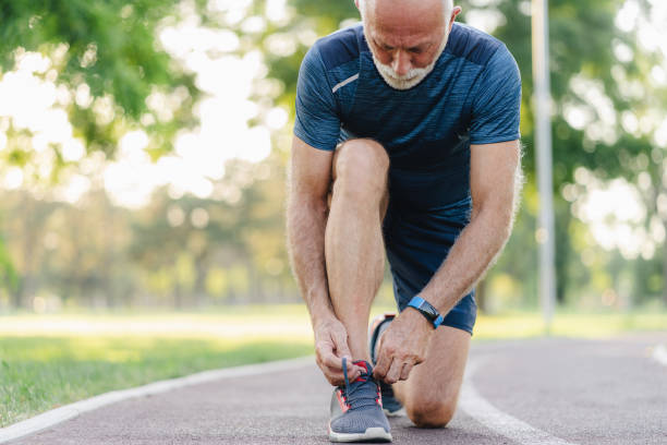 istock Sportsman Tying shoelaces 1568188609