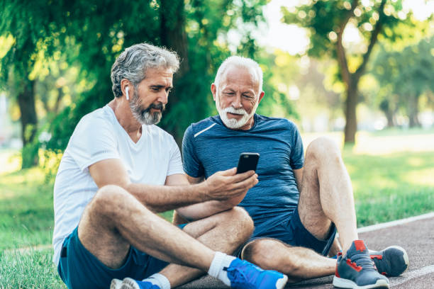 istock Senior friends resting after jogging 1568188613