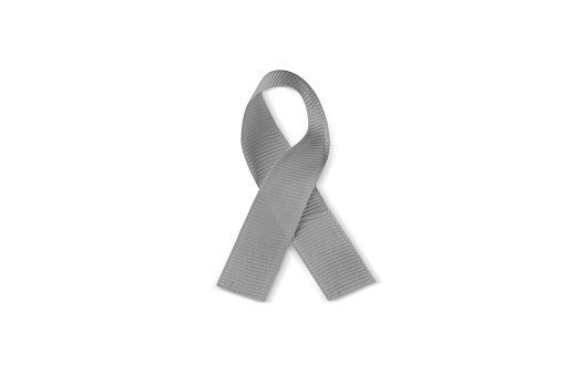 Closeup of a gray awareness ribbon isolated on a white background with a clipping path.