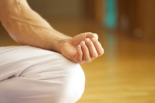 Hand in Yoga Pose stock photo