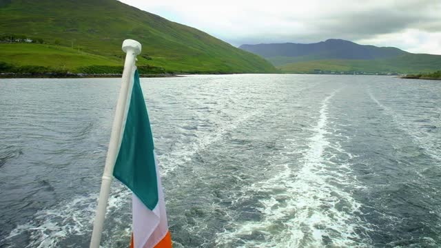 The Irish Flag Billowing Behind a Boat