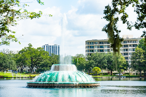 This is a photograph of the Lake Eola fountain in downtown Orlando on a sunny summer day.