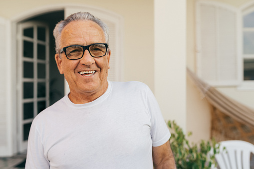 Portrait of a smiling senior man at home