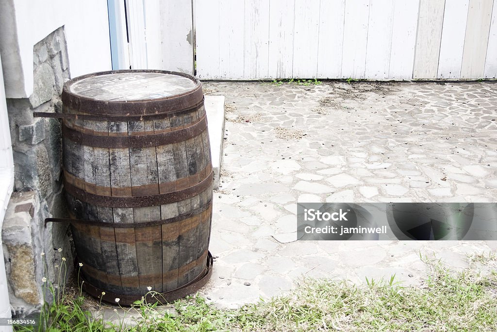 abandoned yard with wooden storage cask Barrel Stock Photo