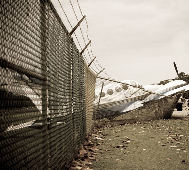 istock small plane crashes through fence in emergency landing 156834606