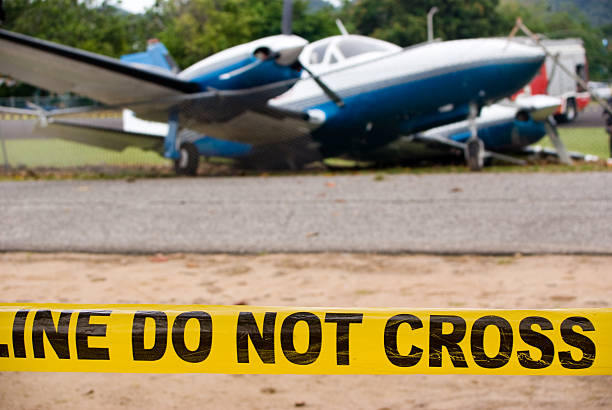 plane crash scene; police line do not cross plane crash scene; police line do not cross airplane crash photos stock pictures, royalty-free photos & images