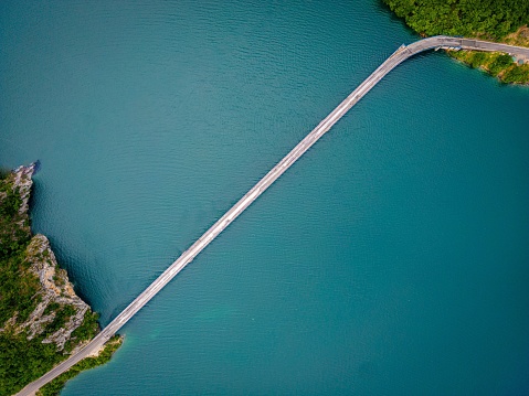An aerial view of a road over Lake Piva, Montenegro