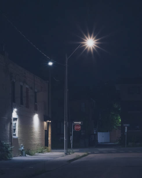 istock Urban Cityscape - Street light at night 1568366087