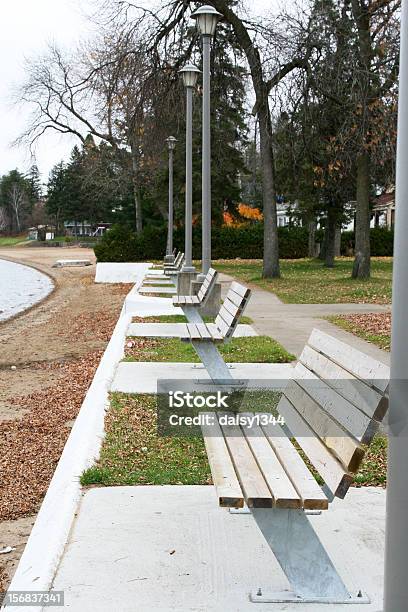 Row Of Benches Along A Beach Stock Photo - Download Image Now - Beach, Bench, Block Shape