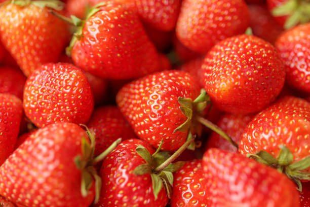 istock Fresh organic red strawberry fruit background 1568438156