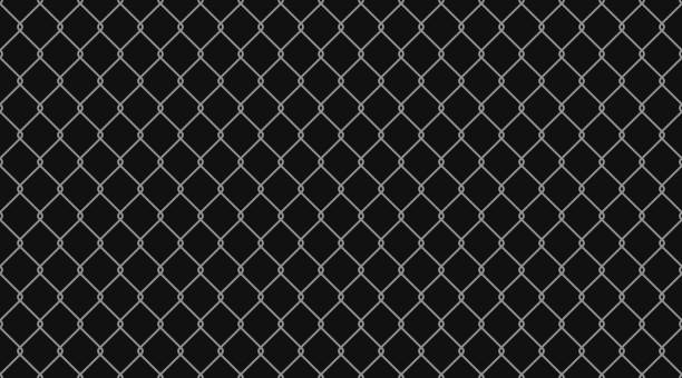 istock Steel wire chain link fence or rabitz seamless pattern. Metal lattice with rhombus shape silhouette. Grid fence background. Prison wire mesh seamless texture. Vector illustration on black background 1568439259