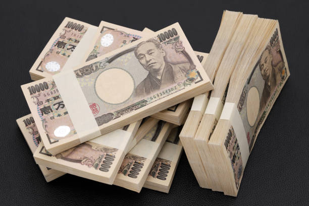 Stack of Japanese yen. 10,000 yen bundle of bills. stock photo