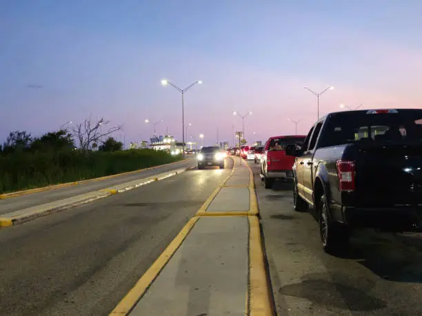 Line Of Vehicles On The Street Exiting And Entering Galveston Bay Ferry Boat Terminal