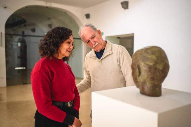 istock Mixed Heterosexual Couple at an Art Biennale 1568455338