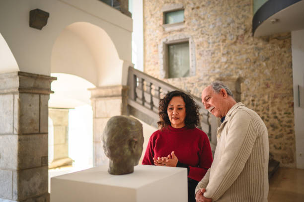 istock Mixed Heterosexual Couple Visiting a National Art and Craft Gallery 1568455341