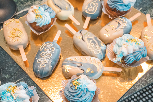 A delectable assortment of desserts, ranging from classic to exciting new flavors of sweet treats. Baby shower celebration.