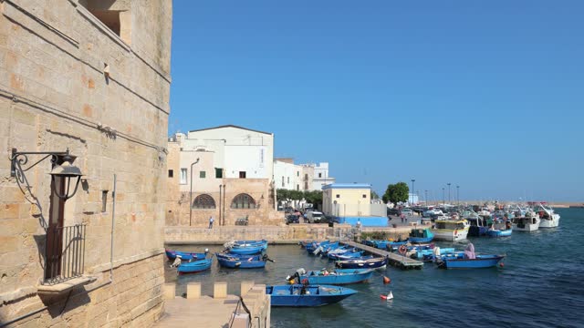 Fishing boat in Monopoli harbour in Puglia, italy