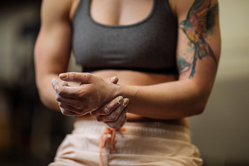 Close-up shot of an injured female holding her wrist