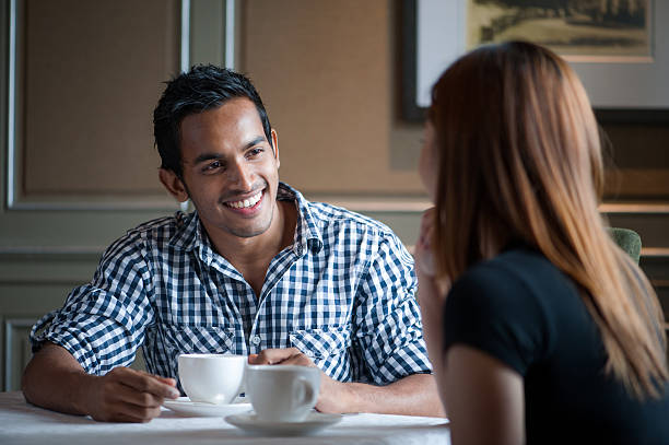 istock Asian couple having drinks in a cafe 156849107