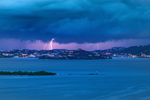 Stormy weather at sunset, Lightning strikes over Red hook, St. Thomas, United States Virgin Islands