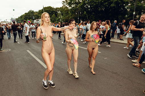 Berlin, Germany, Europe - July 22, 2023: Christopher Street Day In Berlin, naked participants walking outdoors.