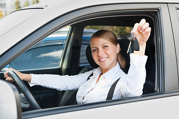 istock young woman sitting in car 156859115