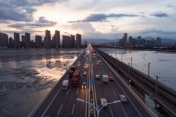 istock Blurred image of traffic flow on cross-sea expressway 1568598970