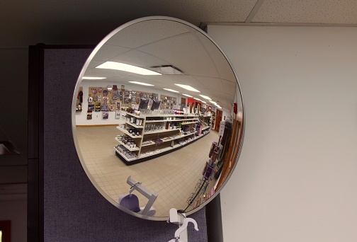 Reflection in a security mirror in a souvenir shop