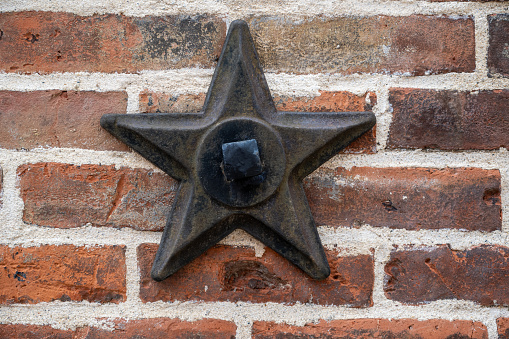 Metal Support Star on a Brick Wall