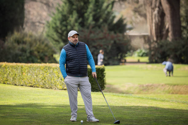 istock Adult man playing golf in autumn 1568674664