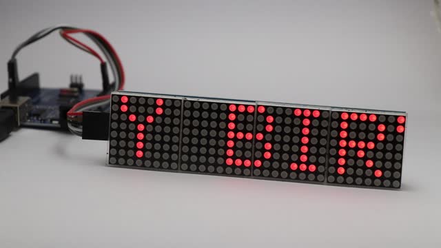 LED matrix display of 8x64 size scrolling message screen with a happy birthday message. Programmable micro controller with custom Text display