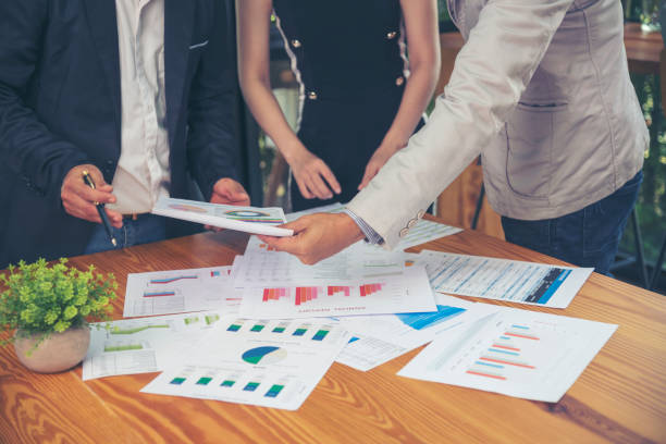 istock Business strategy team report chart, graph, infographic data analyze financial report plan. Hands team partner planning marketing finance statistics sale report with excel spreadsheet accountting 1568715111
