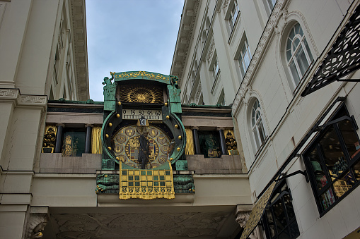 Vienna, Austria - June 27, 2023: Ancient Anker clock (Ankeruhr) on Hoher markt square in Vienna. A very popular place among tourists. Streets and architecture of the old city.