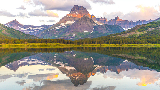 Mount Wilbur Seen on Sunrise with Reflection seen from the Many Glaciers Mountains in Glacier National Park