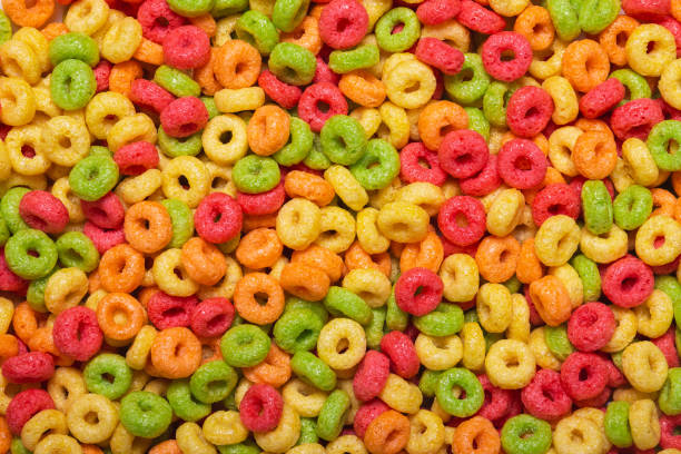 istock Colored sweet corn rings for the whole frame close-up. A quick, fun and healthy breakfast for children 1568742650