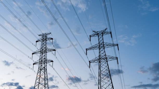 istock high voltage transmission tower at dusk 1568747399