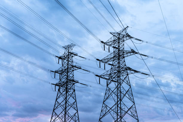 istock high voltage transmission tower at dusk 1568749172
