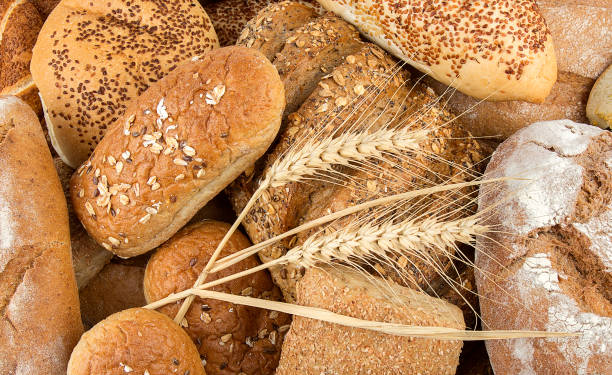 istock Different kinds of bread and bread rolls. Kitchen or bakery poster design 1568749670
