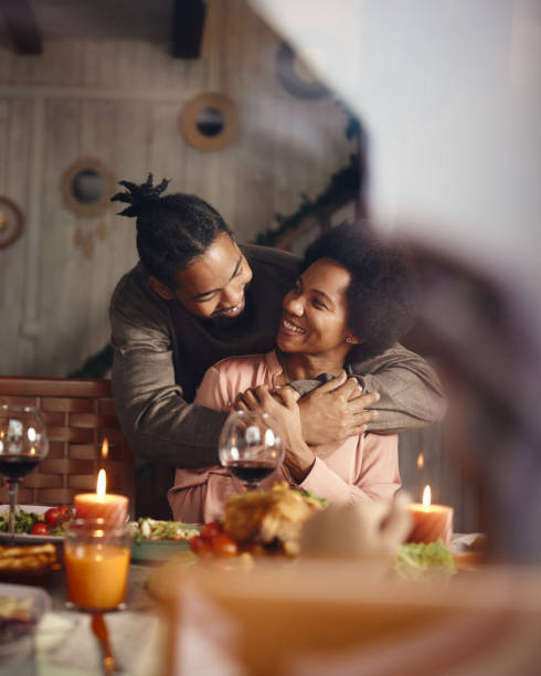 istock Happy black couple talking during a meal in dining room. 1568749906