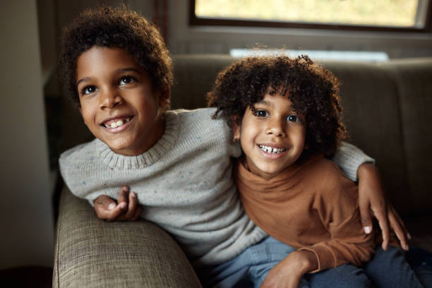 istock Happy black kids enjoying at home. 1568753829