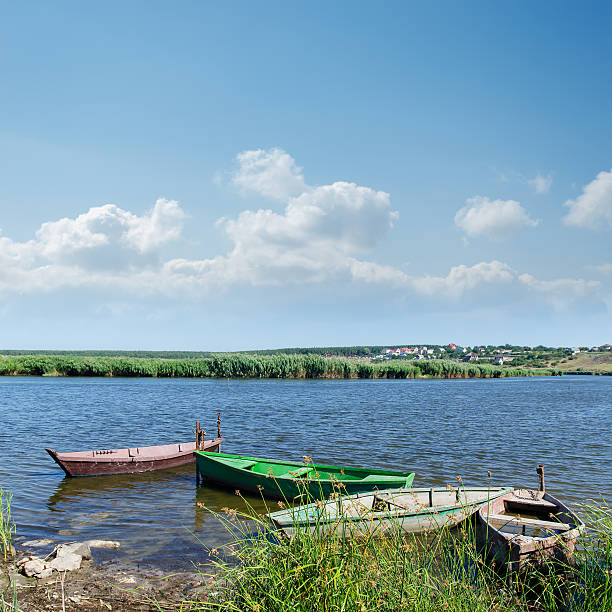 istock river and old boats under cloudy sky 156875474