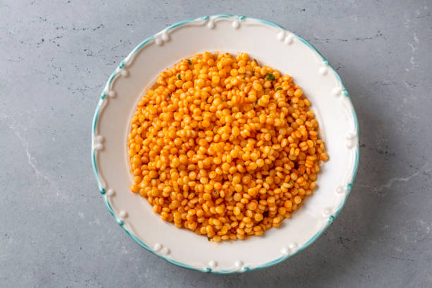 istock Couscous pilaf with tomatoes. Turkish name; domatesli kuskus pilavi 1568759128