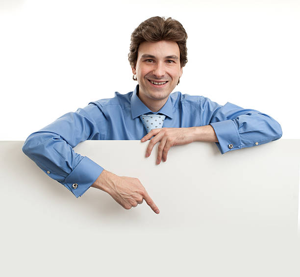 istock Businessman holding blank poster 156875975