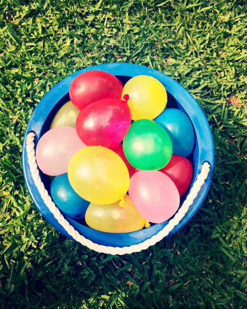 istock Water balloon fight! Pop off! 1568781701