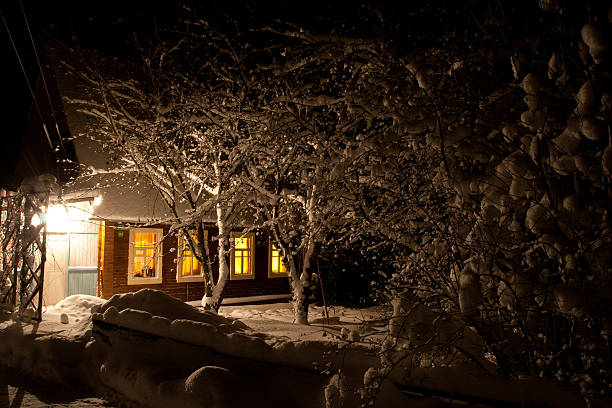istock Village house with illuminated windows at night 156878651